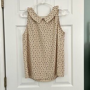 Cream sleeveless top with tiny leaves print. Size M